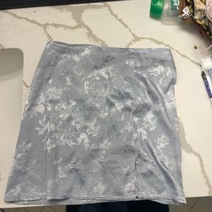 This is a silk (small)dress with floral like print